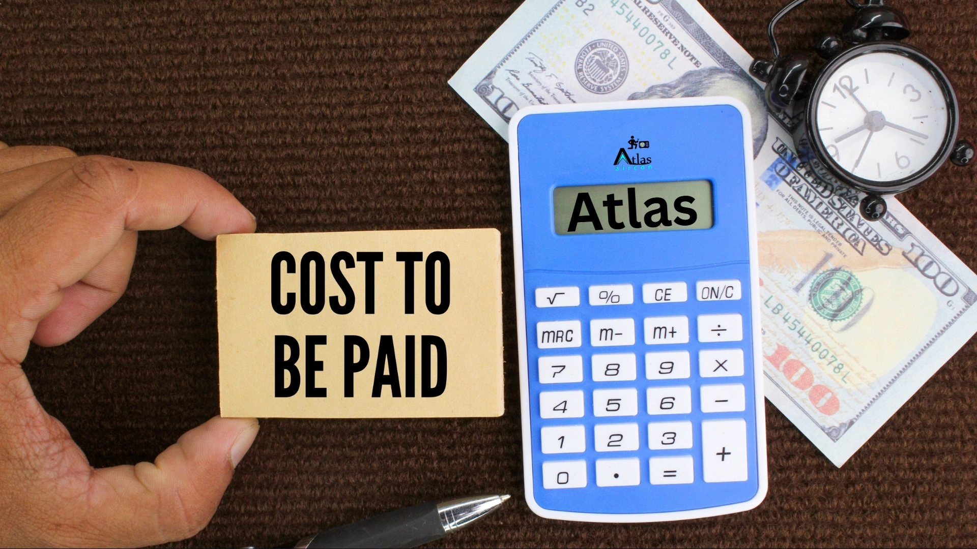 Calculator, pen, and paper money with the word cost, representing service charges